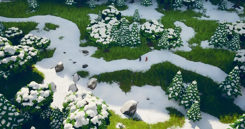 Aerial view of a snowy trail winding between pines
